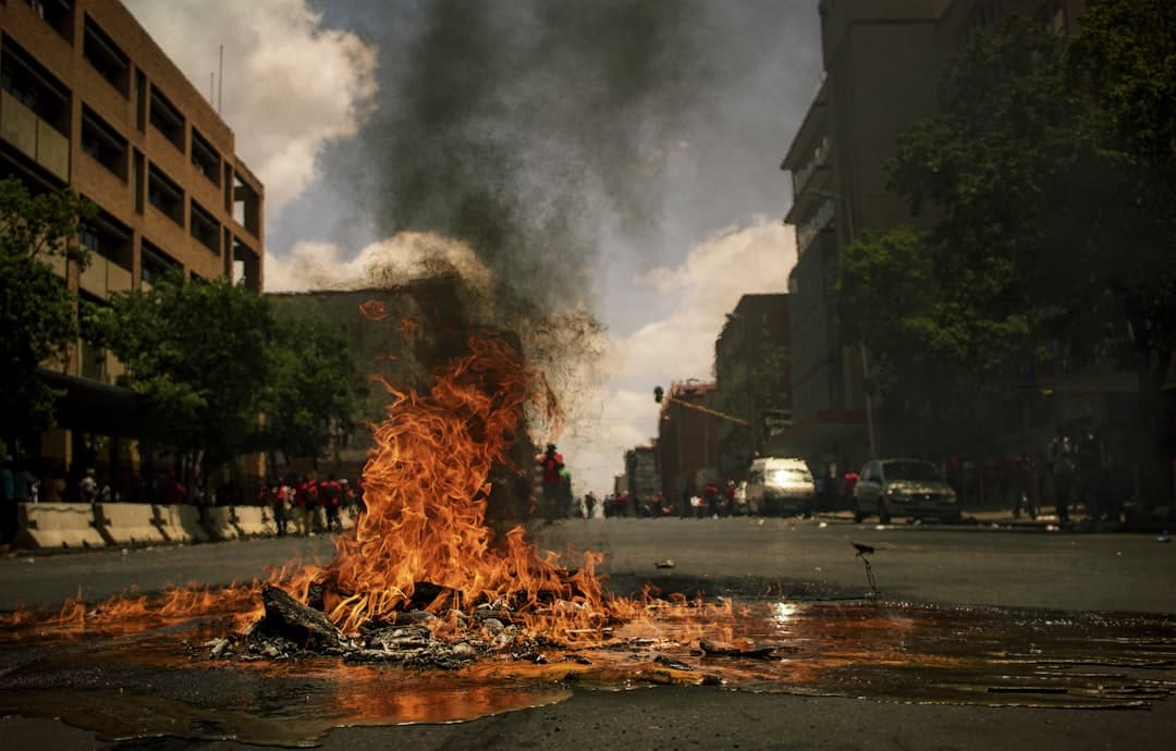 During 2016 South Africa experienced many protests. Most of them were around tertiary education fees. In November 2016, the Economic Freedom Fighters (EFF) party of South Africa took to the streets of Pretoria.
It was mostly calm as the EFF had several marshals walking with the various clusters. Despite the massive police presence, there were a handful of vandals and pyromaniacs around.
I also got pelted with a few stones in the process.