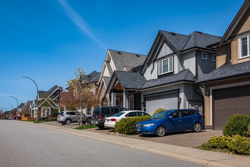 Perfect neighborhood. Houses in suburb at Spring in the north America. Real Estate Exterior Front Houses on a sunny day