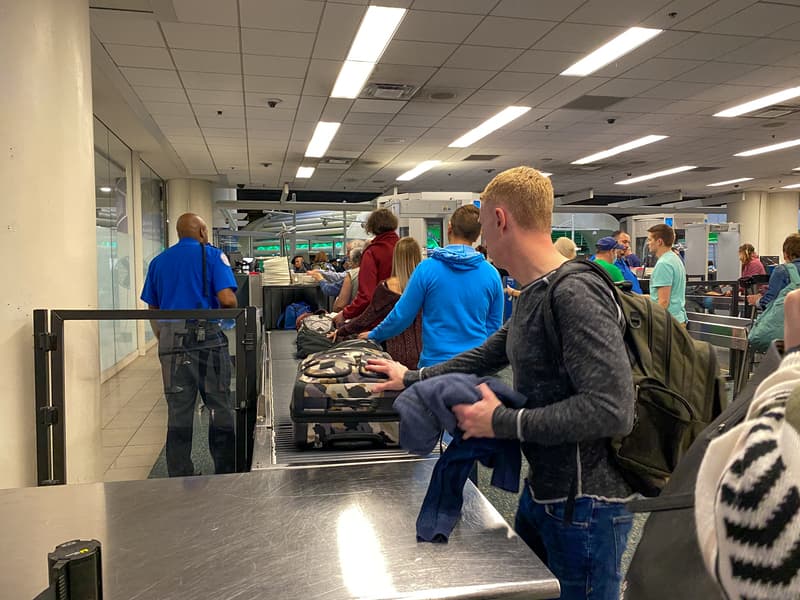 People waiting in line to go through Orlando International Airport MCO TSA security